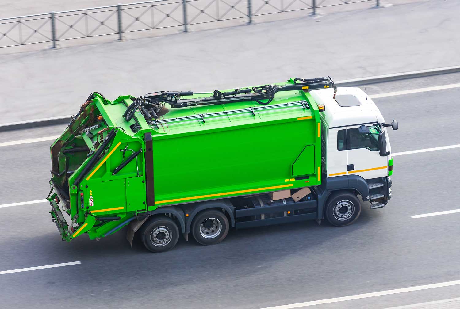 A garbage truck goes to collect waste at the destination.